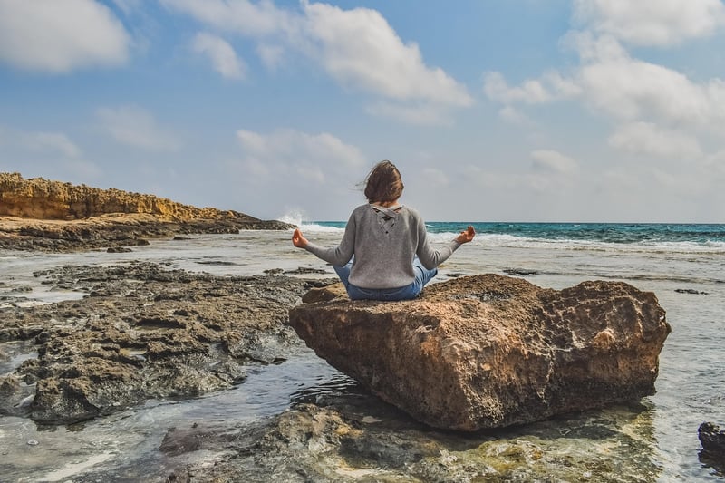 Woman meditating in a yoga pose